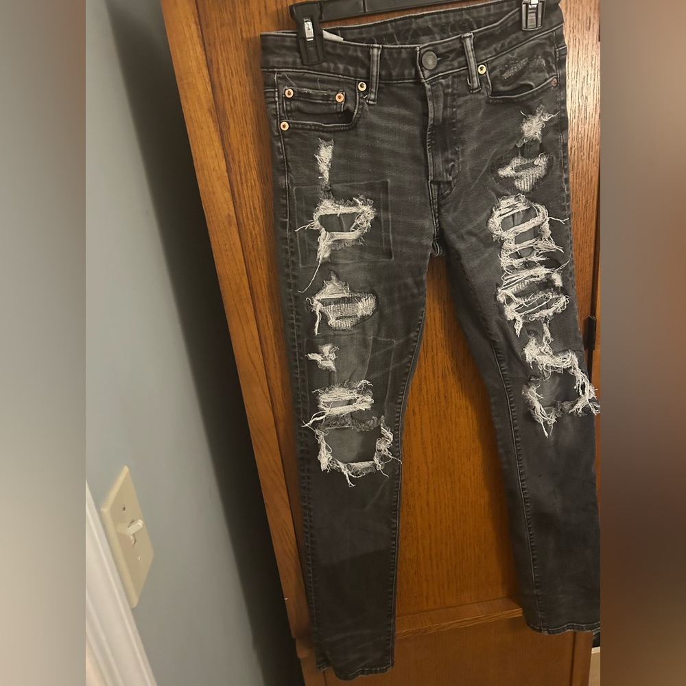 American Eagle Outfitters heavy distressed light wash skinny jeans